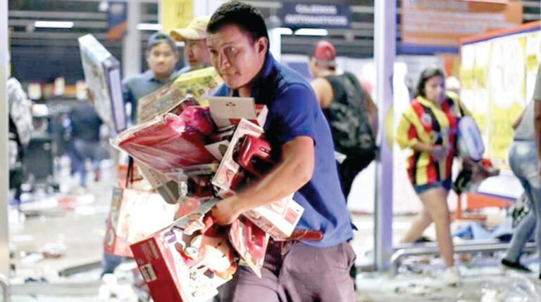 Fake: esta foto no corresponde a un vecino de Puente Alto saqueando un supermercado